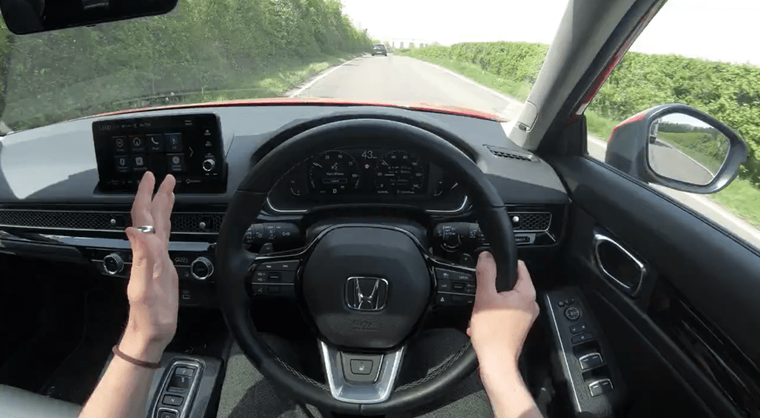 Honda Civic BHEV POV A POV shot from behind the wheel of a Honda CIVIC